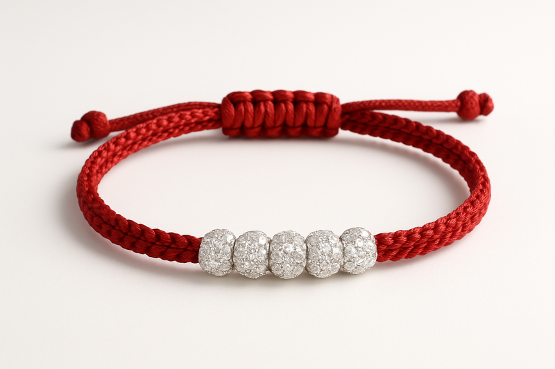 Red cord bracelet with diamond beads center piece