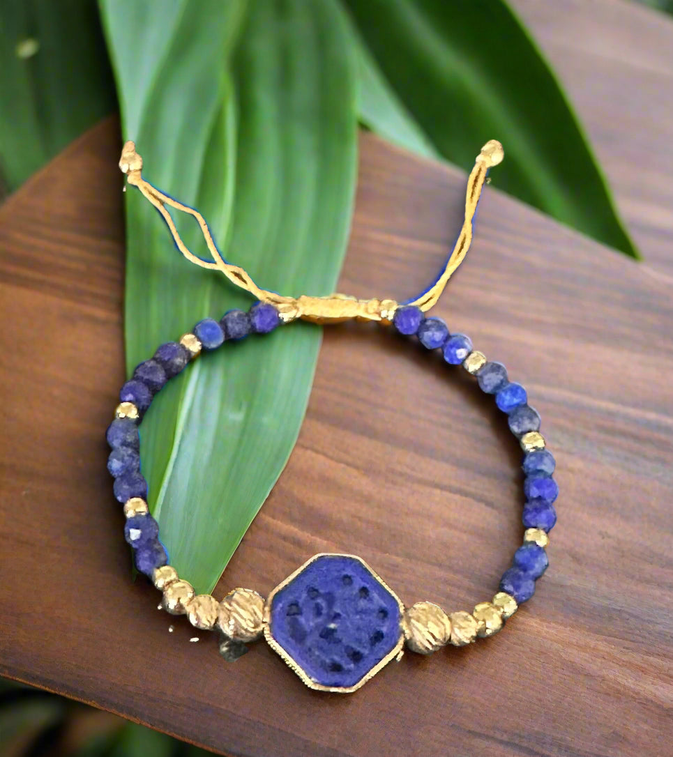 Lapis lazuli bead with gold bead cord bracelet 